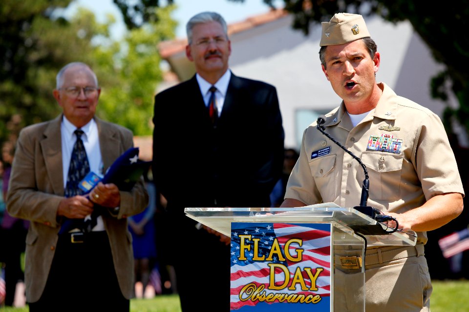 US Navy 100614-N-8863V-143 Capt. Jay Kadowaki, right, commanding officer of Naval Surface Warfare Center (NSWC), Corona Division, speaks during a Flag Day observance
