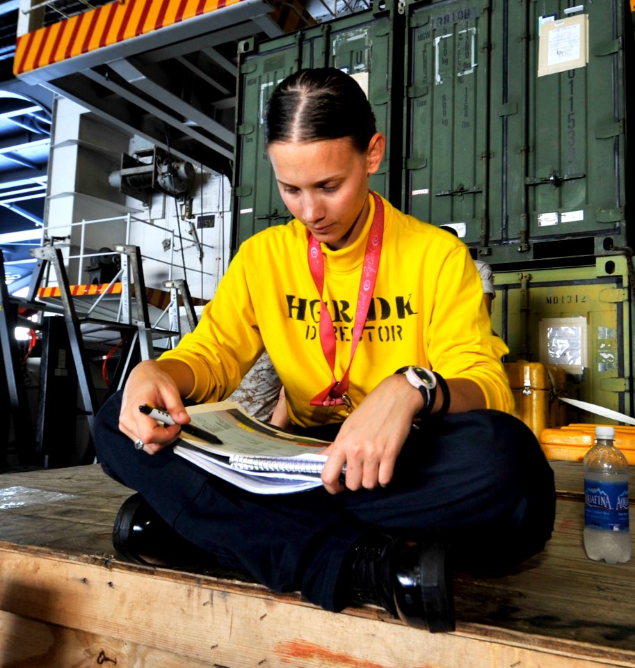US Navy 100617-N-6003P-153 Aviation Boatswain's Mate (Handling) 3rd Class Morgan Crowell, from Newton, Kan., studies for her Enlisted Surface Warfare Specialist exam during a break aboard the Nimitz-class aircraft carrier USS H