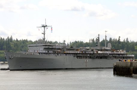 US Navy 100614-N-8119A-022 The submarine tender USS Emory S. Land (AS 39) pulls away from the pier at Naval base Kitsap-Bremerton, Wash photo