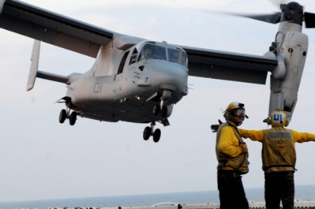 US Navy 100618-N-3852A-004 Sailors guide a Marine Corps V-22 Osprey during flight operations aboard the amphibious assault ship USS Wasp (LHD 1)