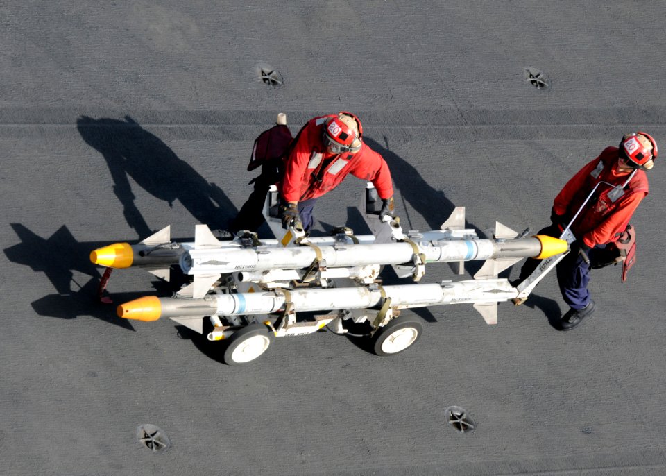 US Navy 100616-N-4236E-062 Aviation Ordnancemen transport ordnance across the flight deck of the aircraft carrier USS Dwight D. Eisenhower (CVN 69)