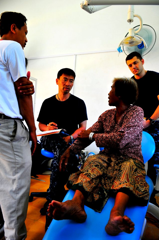 US Navy 100615-N-6597H-099 Capt. Alan Lim performs a preliminary screening for a prospective plastic surgery patient during a medical civic action program at the Sihanouk Provincial Hospital
