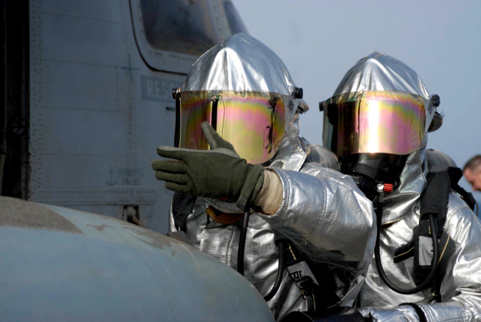 US Navy 100619-N-3358S-049 Sailors check for hot spots on a CH-53E Super Stallion helicopter during a fire drill aboard the amphibious transport dock ship USS Mesa Verde (LPD 19)