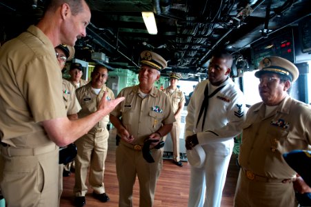 US Navy 100616-N-5319A-007 Capt. Peter Brennan explains the tradition of presenting a command coin to officers of the Mexican navy