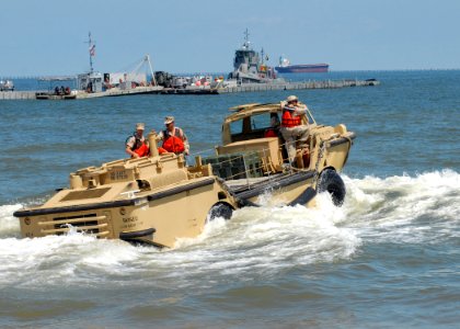 US Navy 100618-N-3165S-125 Reserve component Sailors assigned to Beach Master Unit (BMU) 2 prepare to check the water depth from a landing auxiliary rescue craft