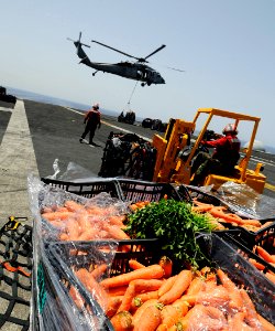 US Navy 100616-N-7317W-013 ailors move supplies aboard the aircraft carrier USS Harry S. Truman (CVN 75) during a vertical replenishment with the Military Sealift Command fleet replenishment oiler USNS Big Horn (T-AO 198)
