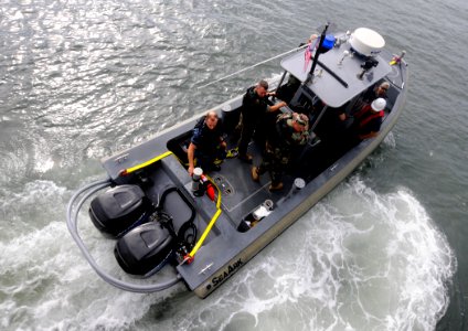 US Navy 100616-N-9643W-243 Sailors and Marines aboard High Speed Vessel Swift (HSV 2) launch a small boat during a Southern Partnership Station 2010 training exercise photo