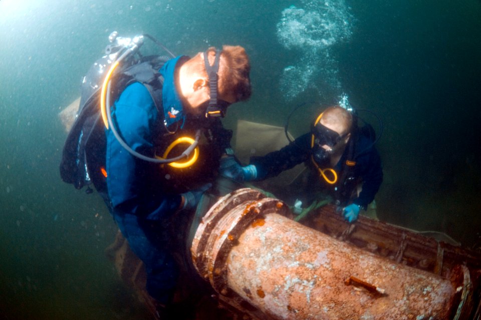 US Navy 100621-N-1134L-068 Navy divers attach lift bags to a sunken engine block off the coast of Barbados