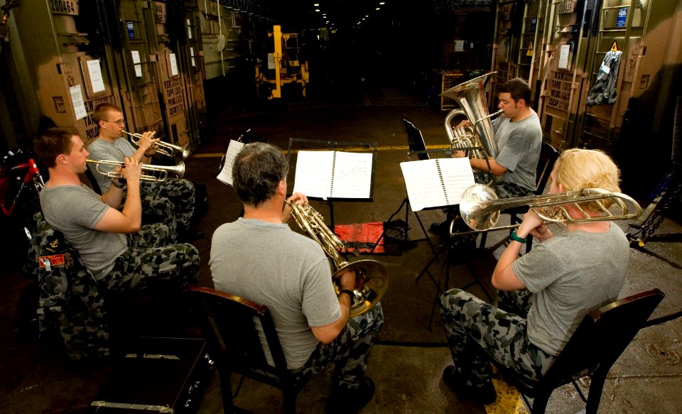 US Navy 100618-O-8247T-018 The Royal Australian Navy brass quintet band practice in the well deck of the Royal Australian Navy amphibious landing platform HMAS Kanimbla (L 51) as part of Rim of the Pacific (RIMPAC) 2010 exercis