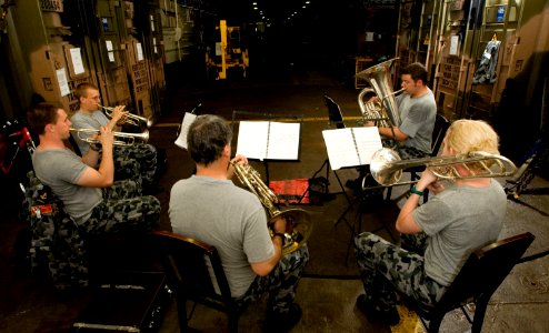 US Navy 100618-O-8247T-018 The Royal Australian Navy brass quintet band practice in the well deck of the Royal Australian Navy amphibious landing platform HMAS Kanimbla (L 51) as part of Rim of the Pacific (RIMPAC) 2010 exercis