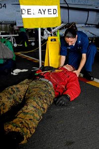 US Navy 100617-N-6362C-039 Hospital Corpsman 3rd Class Jodie Stump tends to a simulated casualty during a mass casualty drill aboard the Nimitz-class aircraft carrier USS Harry S. Truman (CVN 75) photo