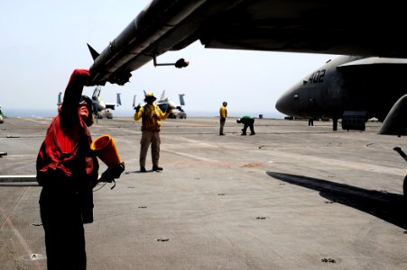 US Navy 100617-N-6604E-015 Aviation Ordnanceman Airman Eric Cooper inspects ordnance prior to the launch of an F-A-18C Hornet from the Wildcats of Strike Fighter Squadron (VFA) 131 aboard the aircraft carrier USS Dwight D. Eise