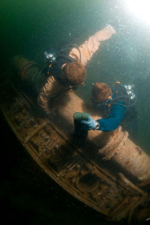 US Navy 100621-N-1134L-012 Navy Diver 2nd Class Dave Orme and Navy Diver 2nd Class Troy Crowder attach lift bags to a sunken engine block off the coast of Barbados
