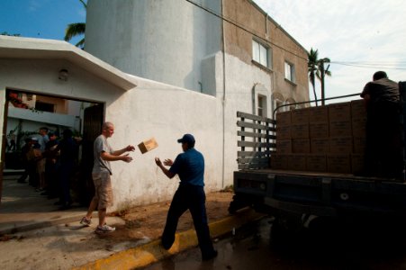 US Navy 100617-N-5319A-049 Sailors and Marines assigned to the amphibious transport dock ship USS New Orleans (LPD 18) and Mexican sailors off-load supplies from Project Handclasp during a community service project