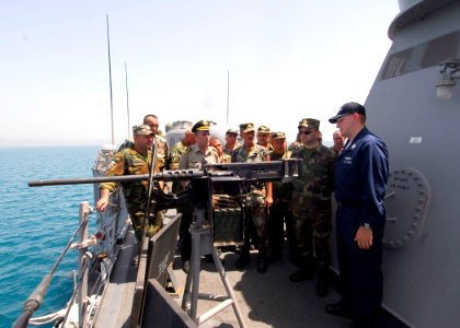 US Navy 100617-N-7638K-172 Electronics Technician Elijah Merchant, from Jacksonville, Fla., gives a tour of the guided-missile frigate USS Taylor (FFG 50) to members of the Albanian Armed Forces Non-Commissioned Officers Academ