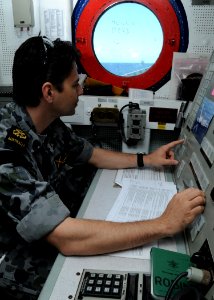 US Navy 100620-N-3327M-006 Electronic Technician Petty Officer Damian O'Shannessy, assigned to the Australian guided-missile frigate HMAS Newcastle (FFG 06), demonstrates launch control procedures for the SM-2 Harpoon missiles
