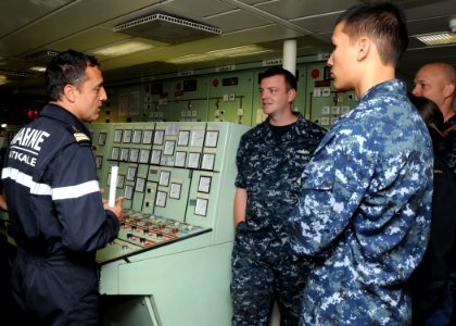 US Navy 100618-N-3327M-064 Capt. Renaud Bondil, commandant of the French navy frigate FS Prairial (F 731), describes the engine control room of Prairial to Sailors assigned to the guided-missile cruiser USS Chosin (CG 65)