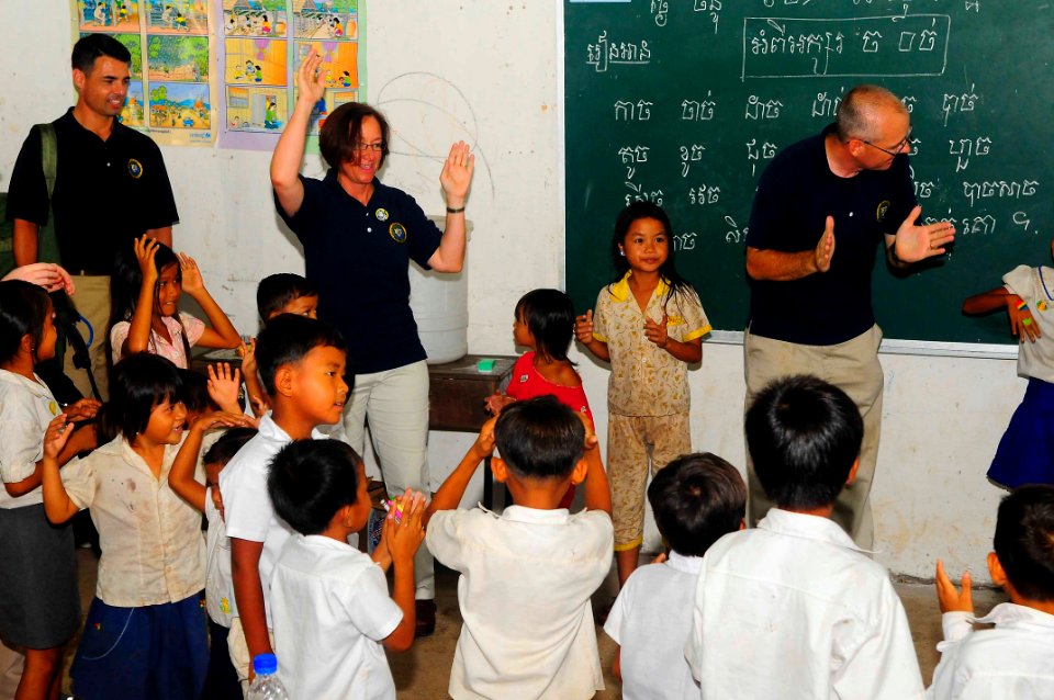 US Navy 100621-N-6410J-234 Capt. Lisa M. Franchetti, commander of Pacific Partnership 2010, plays a game with students at Ohtres Chas Primary School during a Pacific Partnership community service event