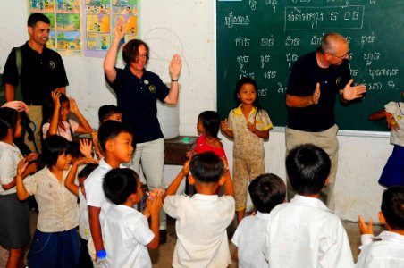 US Navy 100621-N-6410J-234 Capt. Lisa M. Franchetti, commander of Pacific Partnership 2010, plays a game with students at Ohtres Chas Primary School during a Pacific Partnership community service event