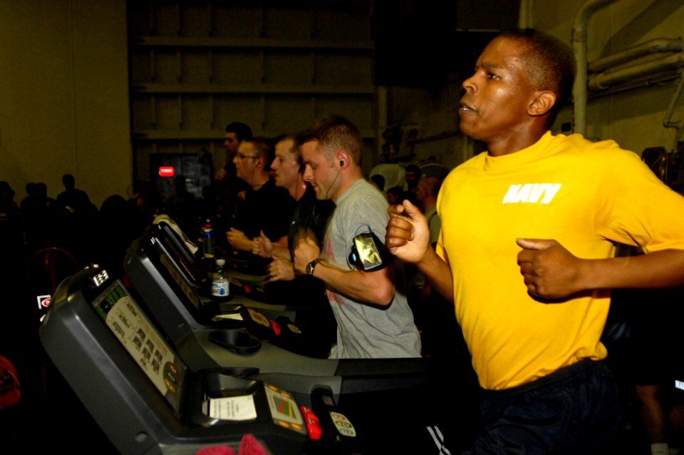 US Navy 100618-N-6362C-116 Sailors and Marines run the ditch on treadmills, competing in teams to see who can first run the transit distance of 116.2 miles, as part of a tradition while transiting the Suez Canal