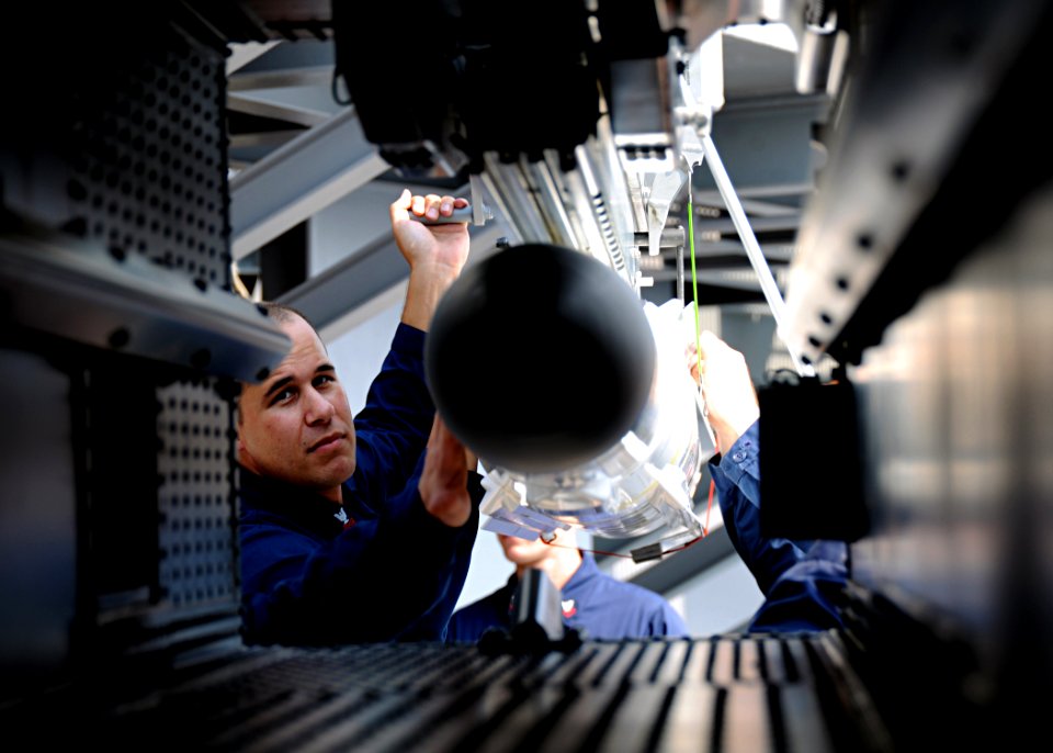 US Navy 100622-N-3885H-178 Fire Controlman 1st Class John Rodriguez-Hardy, assigned to the combat systems department of the aircraft carrier USS George H.W. Bush (CVN 77), loads a NATO Sea Sparrow missile