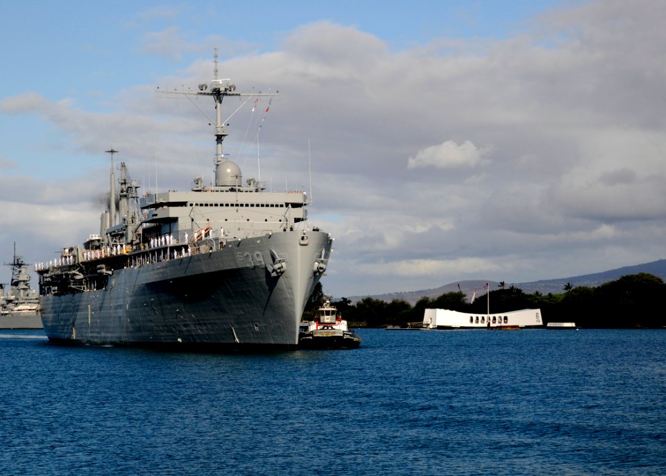 US Navy 100622-N-3560G-001 The Military Sealift Command submarine tender USS Emory S. Land (AS 39) renders honors as she passes the USS Arizona Memorial