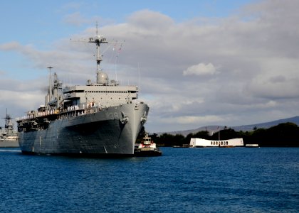US Navy 100622-N-3560G-001 The Military Sealift Command submarine tender USS Emory S. Land (AS 39) renders honors as she passes the USS Arizona Memorial photo
