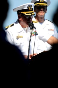US Navy 100622-N-9132C-016 Capt. Kenneth J. Norton, commanding officer of the aircraft carrier USS Ronald Reagan (CVN 76), delivers the opening speech during a burial at sea ceremony aboard the ship photo