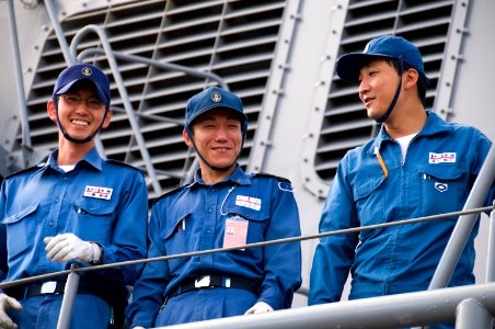 US Navy 100622-N-6674H-008 Sailors aboard the Japan Maritime Self-Defense Force guided-missile destroyer JS Atago (DDG 177) look out at Joint Base Pearl Harbor-Hickam as the ship arrives for Rim of the Pacific (RIMPAC) 2010