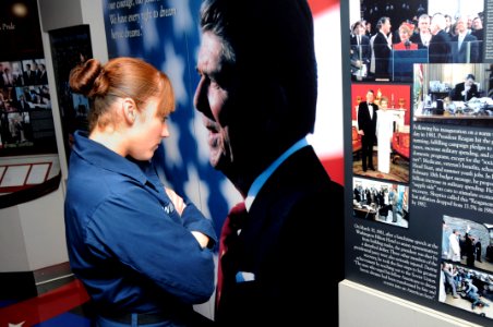 US Navy 100619-N-7042V-037 Seaman Tara Winfield browses various displays in the Ronald Reagan Room aboard the aircraft carrier USS Ronald Reagan CVN 76)