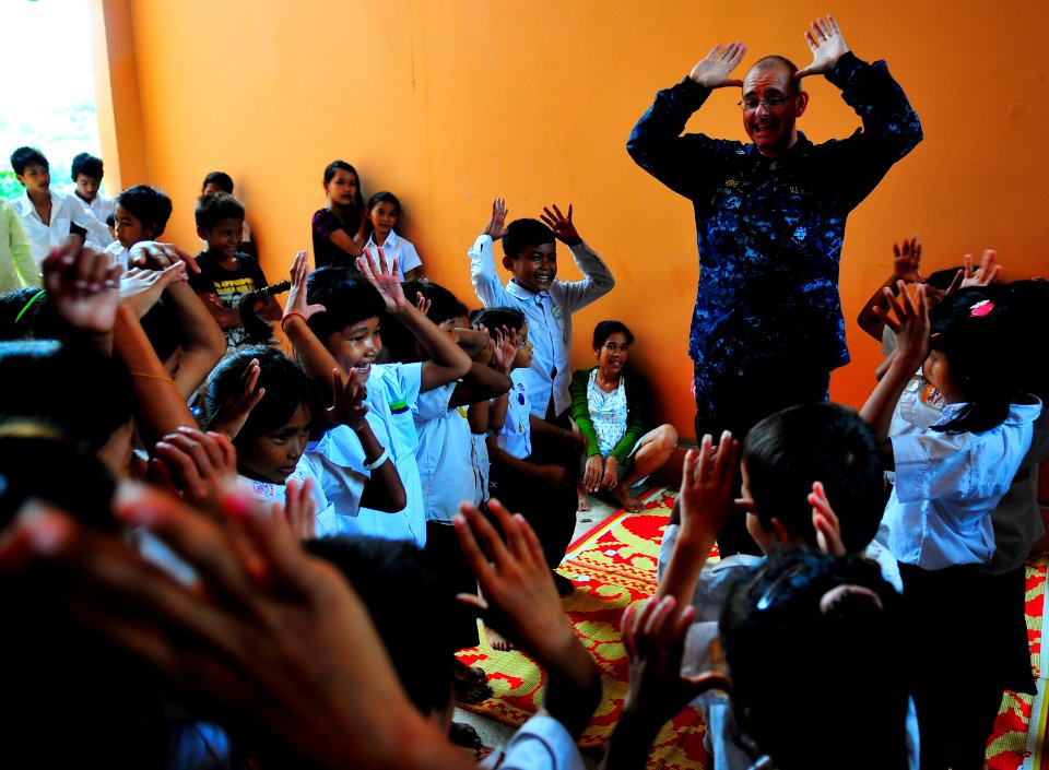 US Navy 100620-N-6597H-477 Cambodian children play games with Lt. Derrick Horne during a Pacific Partnership 2010 community service event at the Enfants du Cambodge orphanage