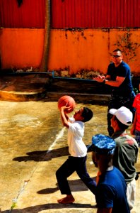 US Navy 100620-N-6597H-173 Two Sailors play basketball with a Cambodian child during a Pacific Partnership 2010 community service event at the Enfants du Cambodge orphanage