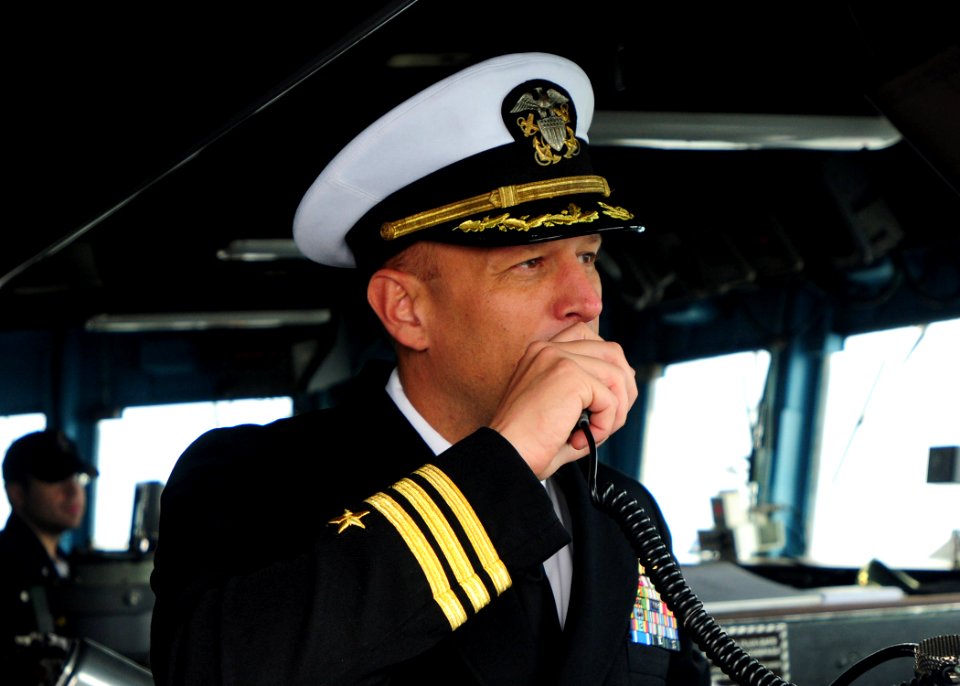 US Navy 100619-N-9301W-662 Cmdr. Scott Smith, commanding officer of the guided-missile frigate USS Klakring (FFG 42), thanks the Chilean naval ships after completing a photo exercise and rendering of honors