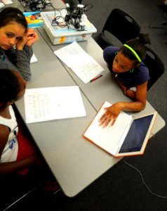 US Navy 100623-N-6046S-115 Students participating in the two-week MySTEM summer program look up building codes for an upcoming project at Naval Support Activity Mid-South