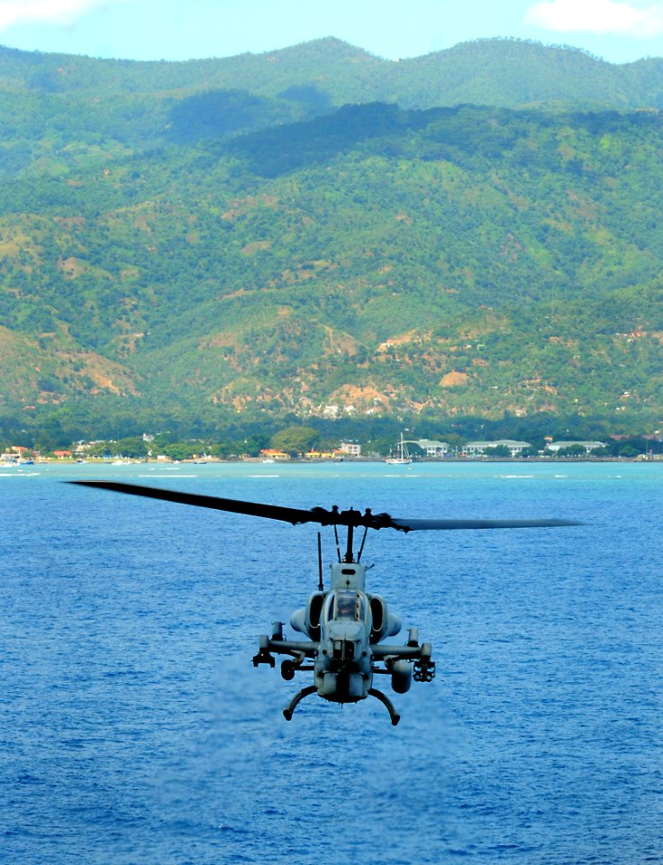 US Navy 100620-N-7948R-063 An AH-1W Super Cobra helicopter flies off the coast of Dili, Timore-Leste during flight operations aboard the amphibious assault ship USS Peleliu (LHA 5)