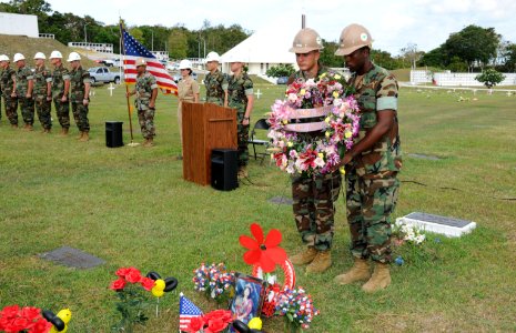 US Navy 100621-N-1906L-005 Builder 3rd Class Daniel Brown, right, and Construction Electrician 3rd Class Richard Dunaway lay a wreath at the grave of Vicenta Chargualaf Peredo, also known as, Seabee Betty