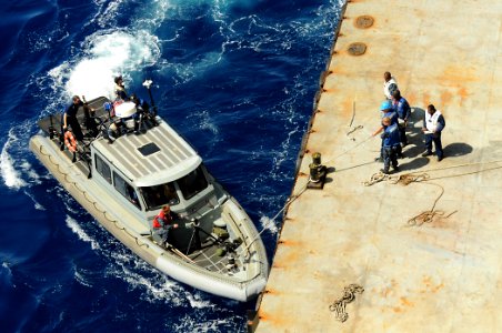 US Navy 100620-N-7948R-077 Sailors prepare to conduct a security patrol for the amphibious assault ship USS Peleliu (LHA 5)