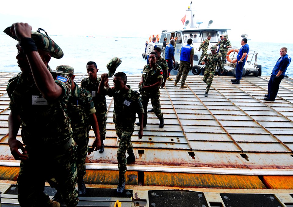 US Navy 100623-N-7948R-261 Personnel from the Timor Leste Defense Force board the amphibious dock landing ship USS Pearl Harbor (LSD 52)