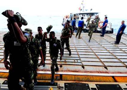 US Navy 100623-N-7948R-261 Personnel from the Timor Leste Defense Force board the amphibious dock landing ship USS Pearl Harbor (LSD 52)