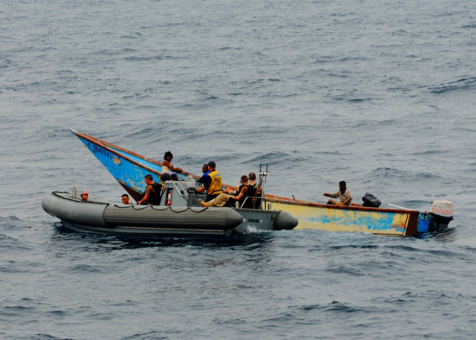 US Navy 100621-N-1092P-176 Members of the visit, board, search and seizure team of the guided-missile destroyer USS Winston S. Churchill (DDG 81) assist stranded fishermen
