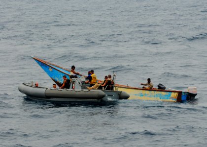 US Navy 100621-N-1092P-176 Members of the visit, board, search and seizure team of the guided-missile destroyer USS Winston S. Churchill (DDG 81) assist stranded fishermen