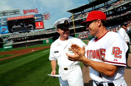 US Navy 100623-N-9818V-194 Master Chief Petty Officer of the Navy (MCPON) Rick West talks with Rick Eckstein, the hitting coach for the Washington Nationals, before the pregame meeting at home plate for the symbolic lineup card