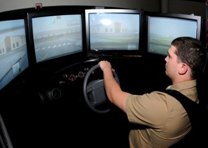 US Navy 100623-N-9860Y-006 Ship's Serviceman Seaman Kevin Simak, from Crystal Lake, Ill. assigned to Personnel Support Detachment Everett, uses a drunk driving simulator during the Save a Life Tour at Naval Station Everett