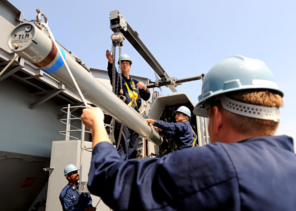 US Navy 100622-N-3885H-258 Sailors assigned to the combat systems department of the aircraft carrier USS George H.W. Bush (CVN 77), load ordnance into one of the ship's rolling airframe missile launchers