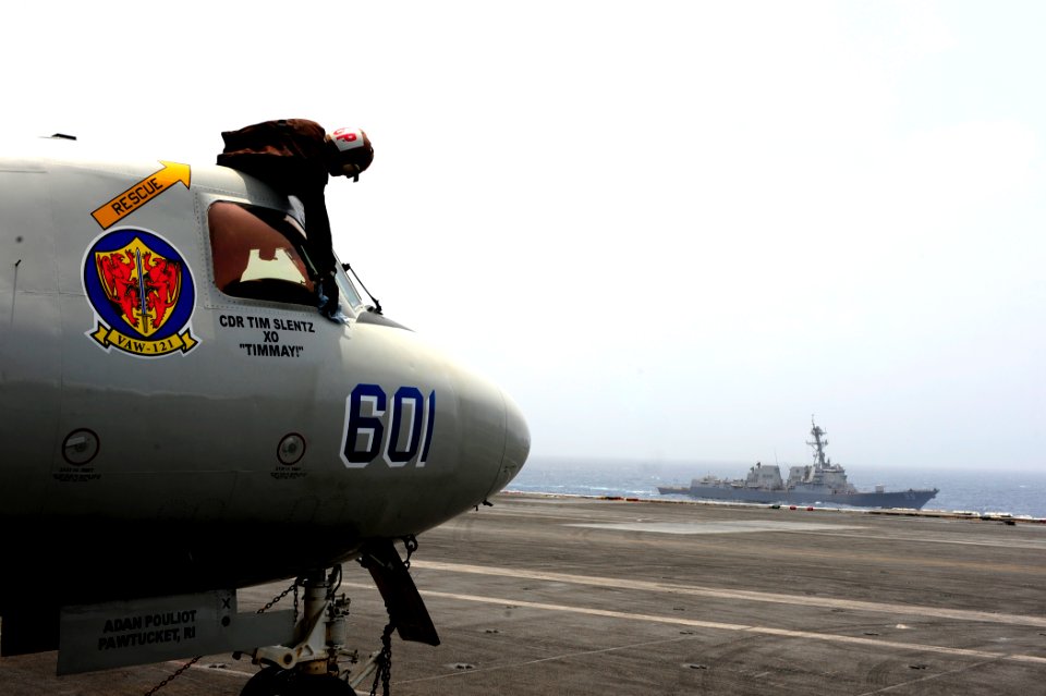 US Navy 100624-N-6604E-114 Airman Paul Adewuyi cleans a window on an E-2C Hawkeye
