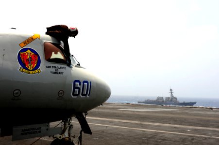 US Navy 100624-N-6604E-114 Airman Paul Adewuyi cleans a window on an E-2C Hawkeye