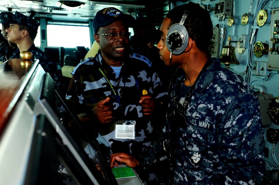 US Navy 100624-N-6604E-076 Lt. Col. Ham Atwooki Kaija, commander of the Air Force for Uganda People's Defense Force, center,