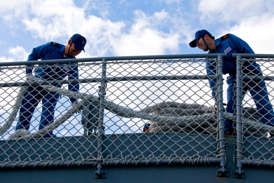 US Navy 100622-N-6674H-009 Sailors aboard the Japan Maritime Self-Defense Force guided-missile destroyer JS Atago (DDG 177) perform line handling as the ship arrives at Joint Base Pearl Harbor-Hickam for Rim of the Pacific (RIM
