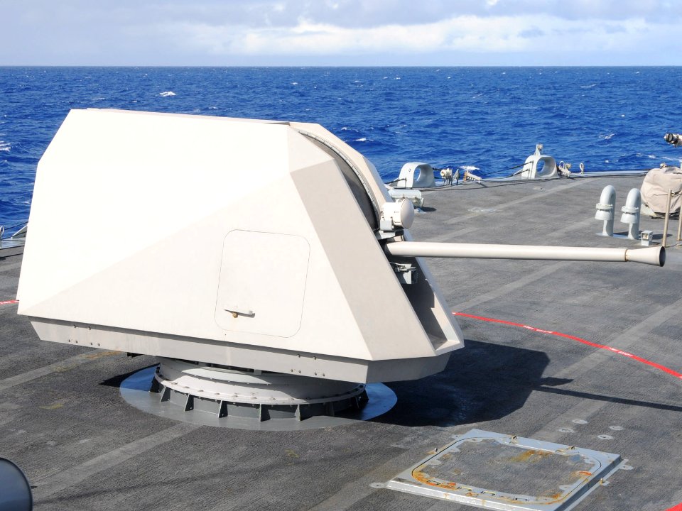 US Navy 100622-N-7058E-161 The littoral combat ship USS Freedom (LCS 1) fires its MK 110 57mm gun during a surface gunnery test (cropped)
