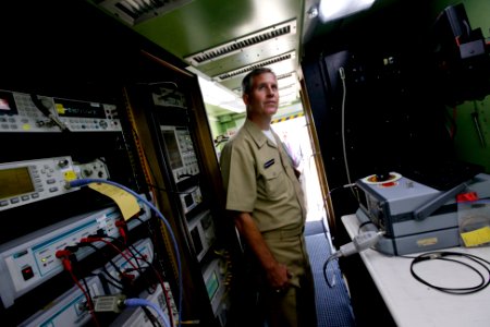 US Navy 100622-N-8863V-415 ear Adm. James J. Shannon, commander of the Naval Surface Warfare Center, inspects the interior of the Expeditionary Test and Measurement System container during a visit to Naval Surface Warfare Cente
